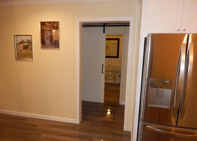 8821 Woodruff Street Houston, TX 77012 - Photo 8 of 20 a view of a bathroom with a glass door