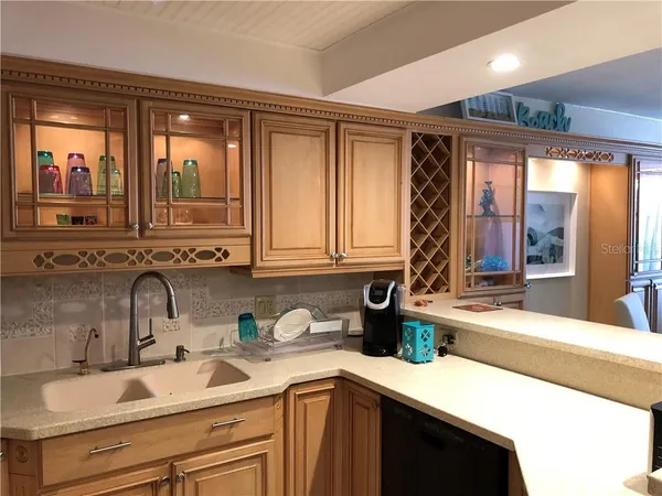 a kitchen with a sink and a window
