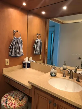a bathroom with a sink and a mirror