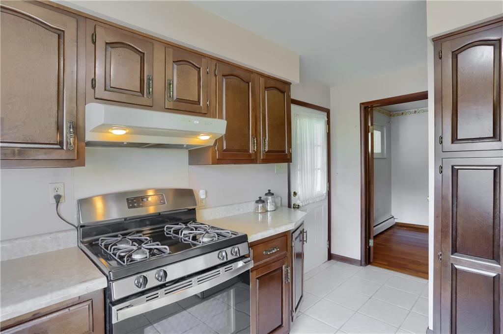 104 Linda Vista Road Sewickley, PA 15143 - Photo 11 of 50 a kitchen with stainless steel appliances granite countertop a stove and a refrigerator