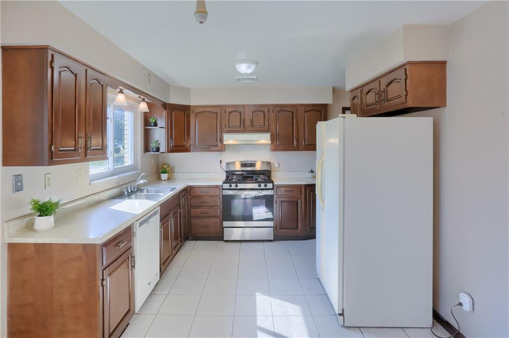 104 Linda Vista Road Sewickley, PA 15143 - Photo 12 of 50 a kitchen with a refrigerator sink and stove