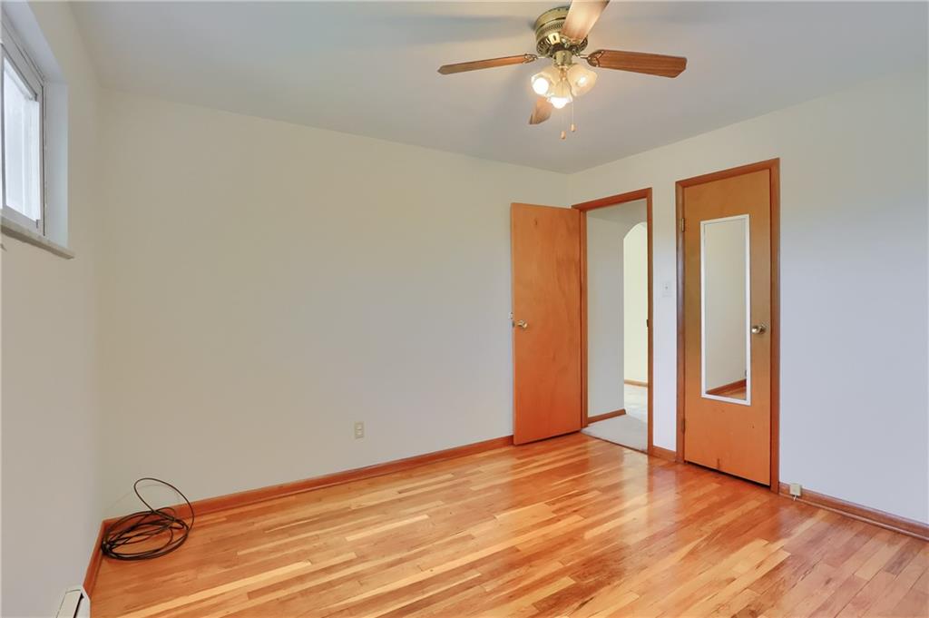 104 Linda Vista Road Sewickley, PA 15143 - Photo 14 of 50 a view of an empty room with window and wooden floor