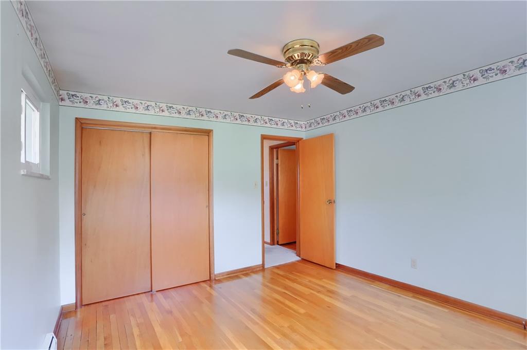 104 Linda Vista Road Sewickley, PA 15143 - Photo 16 of 50 a view of an empty room with wooden floor and a window