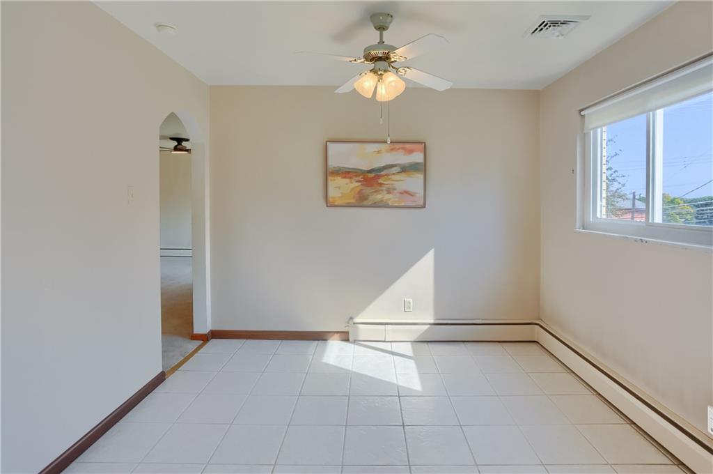 104 Linda Vista Road Sewickley, PA 15143 - Photo 7 of 50 an empty room with windows and fan