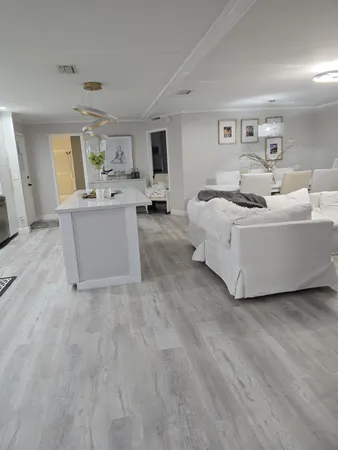 a kitchen with a sink and a stove top oven