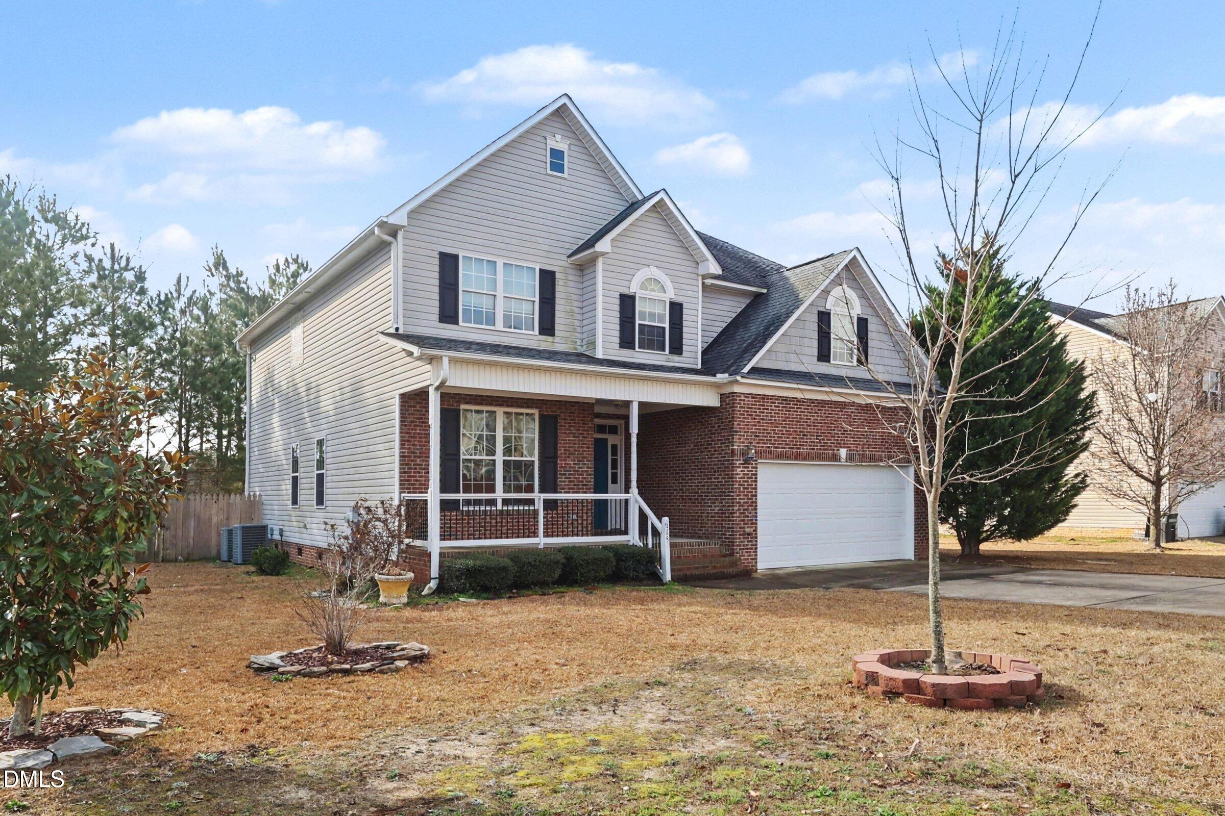 615 Lenoir Drive Spring Lake, NC 28390 - Photo 1 of 39 a front view of a house with a yard
