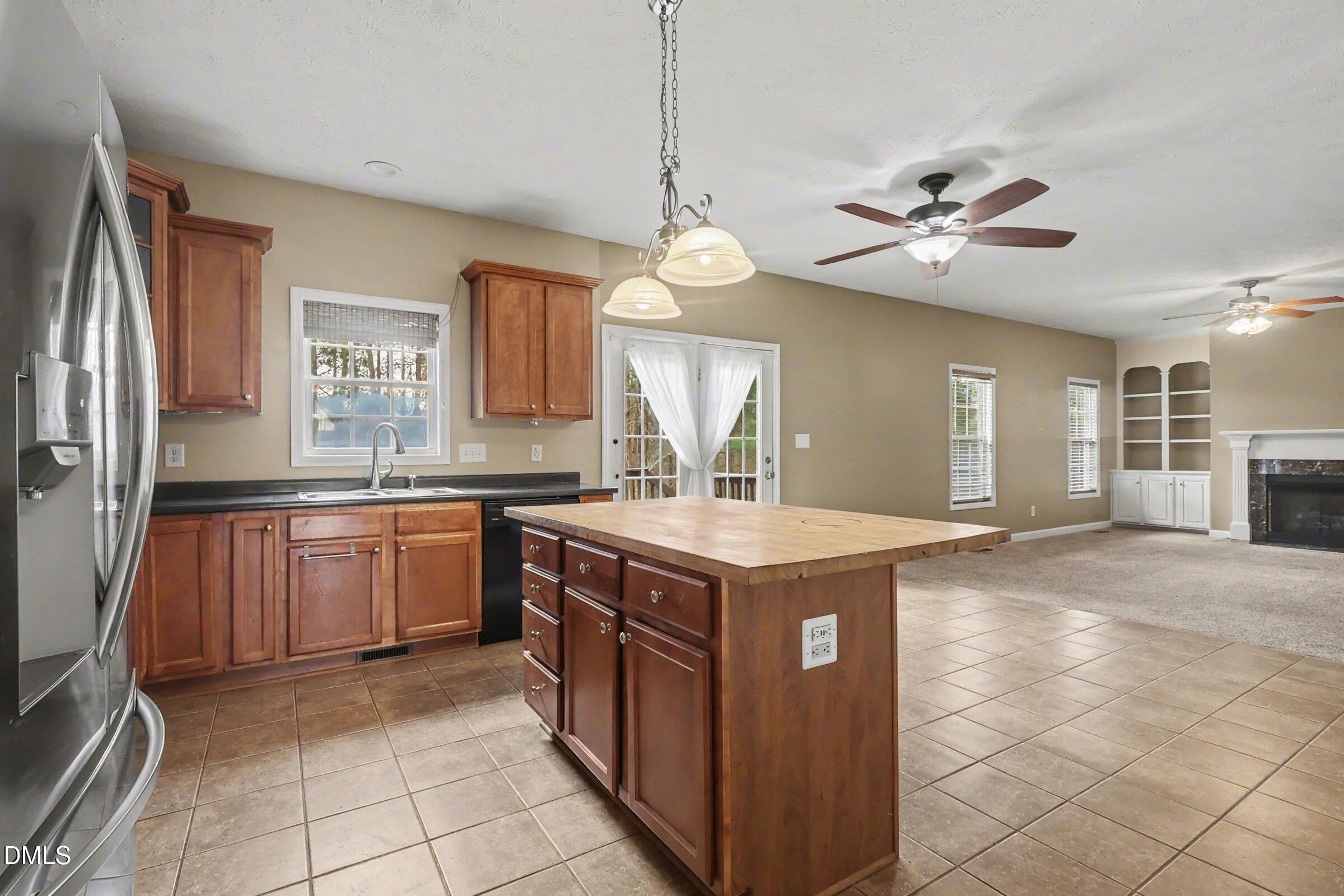 615 Lenoir Drive Spring Lake, NC 28390 - Photo 14 of 39 a kitchen with a stove a sink a refrigerator and a stove