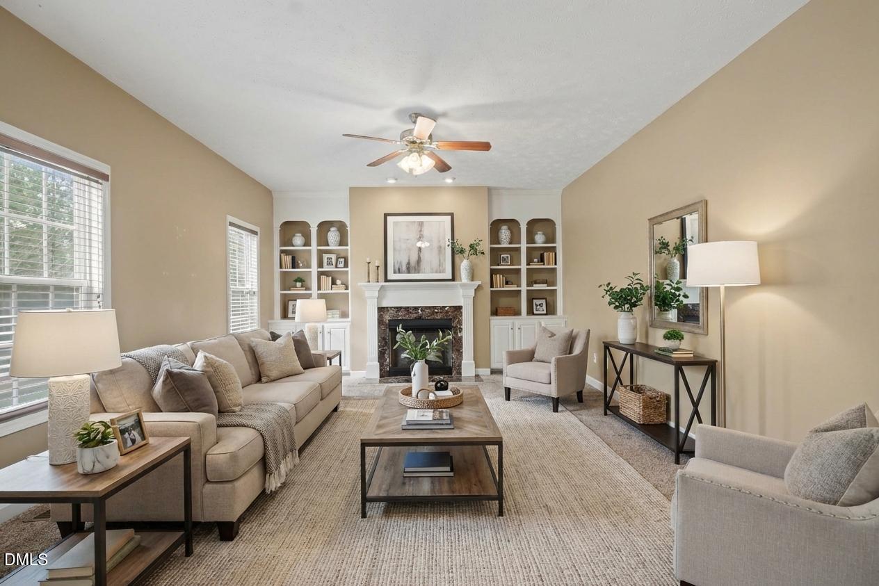 615 Lenoir Drive Spring Lake, NC 28390 - Photo 16 of 39 a living room with furniture a fireplace and a table