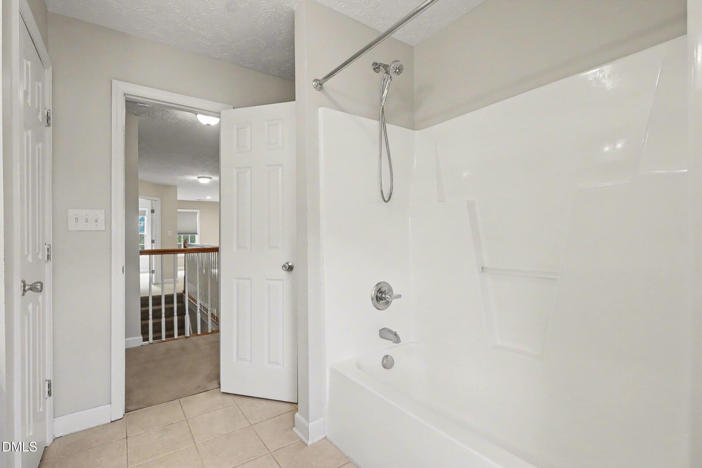 615 Lenoir Drive Spring Lake, NC 28390 - Photo 18 of 39 a bathroom with a bathtub and shower