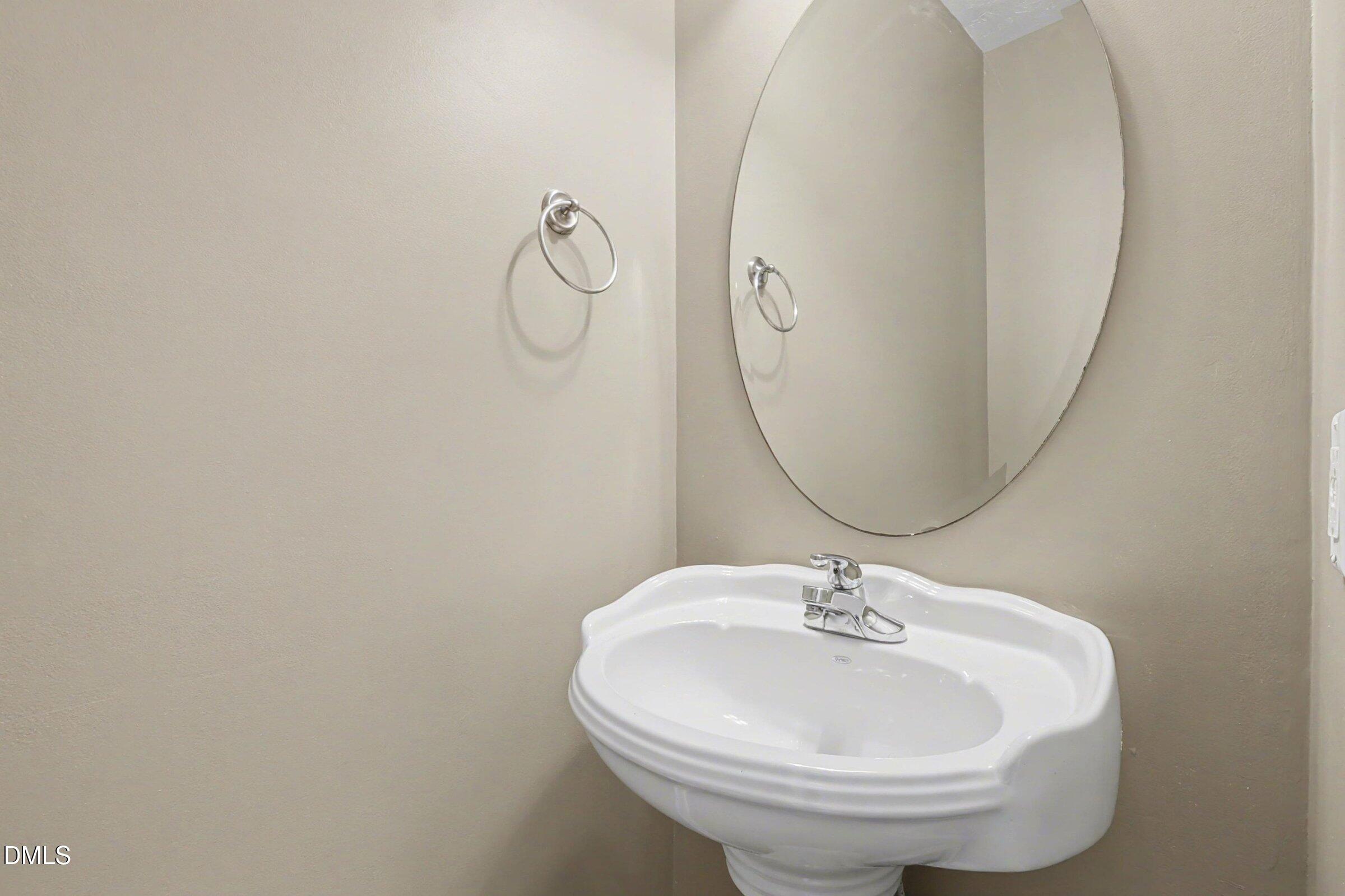 615 Lenoir Drive Spring Lake, NC 28390 - Photo 25 of 39 a bathroom with a sink and mirror