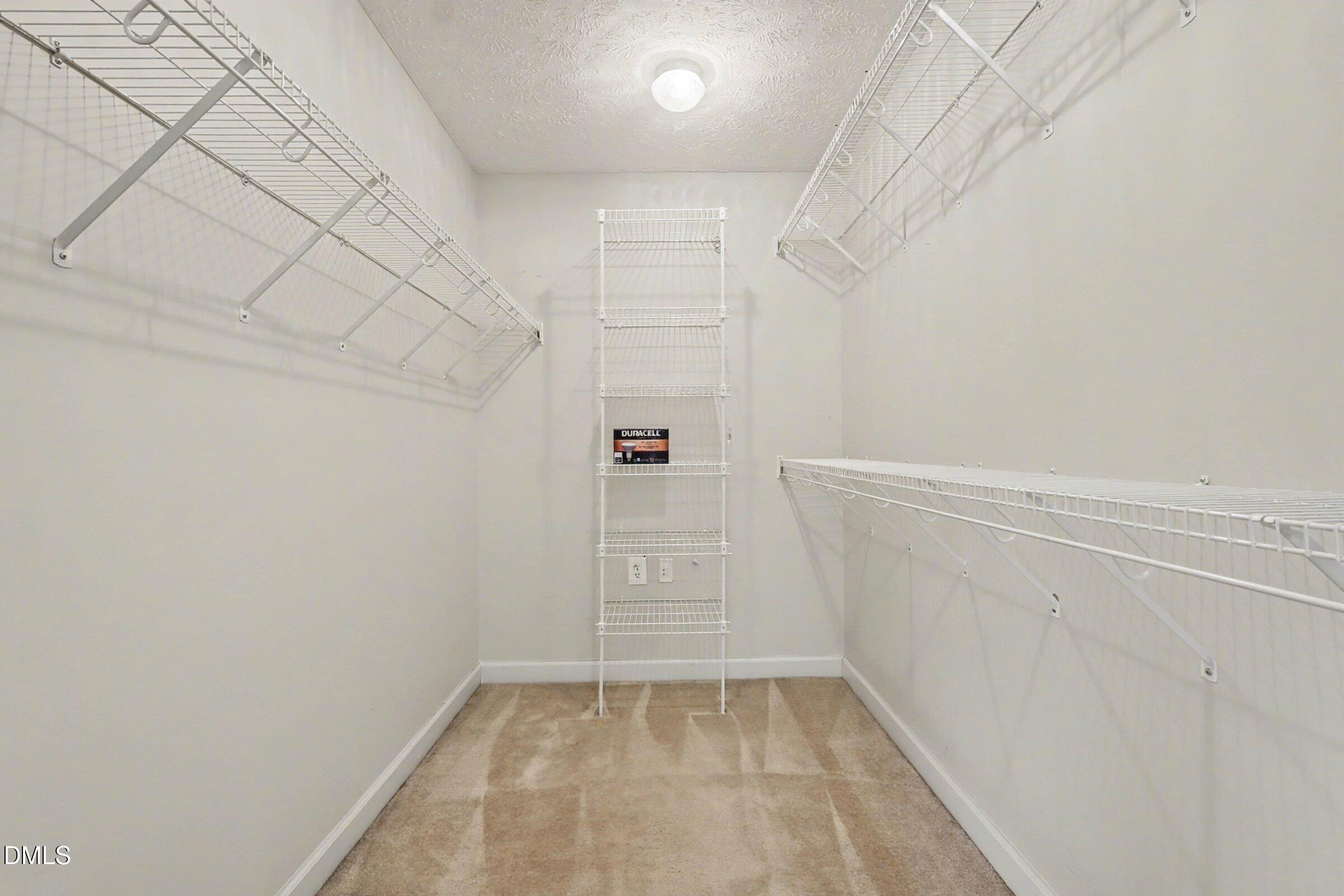 615 Lenoir Drive Spring Lake, NC 28390 - Photo 26 of 39 a view of walk in closet with empty racks