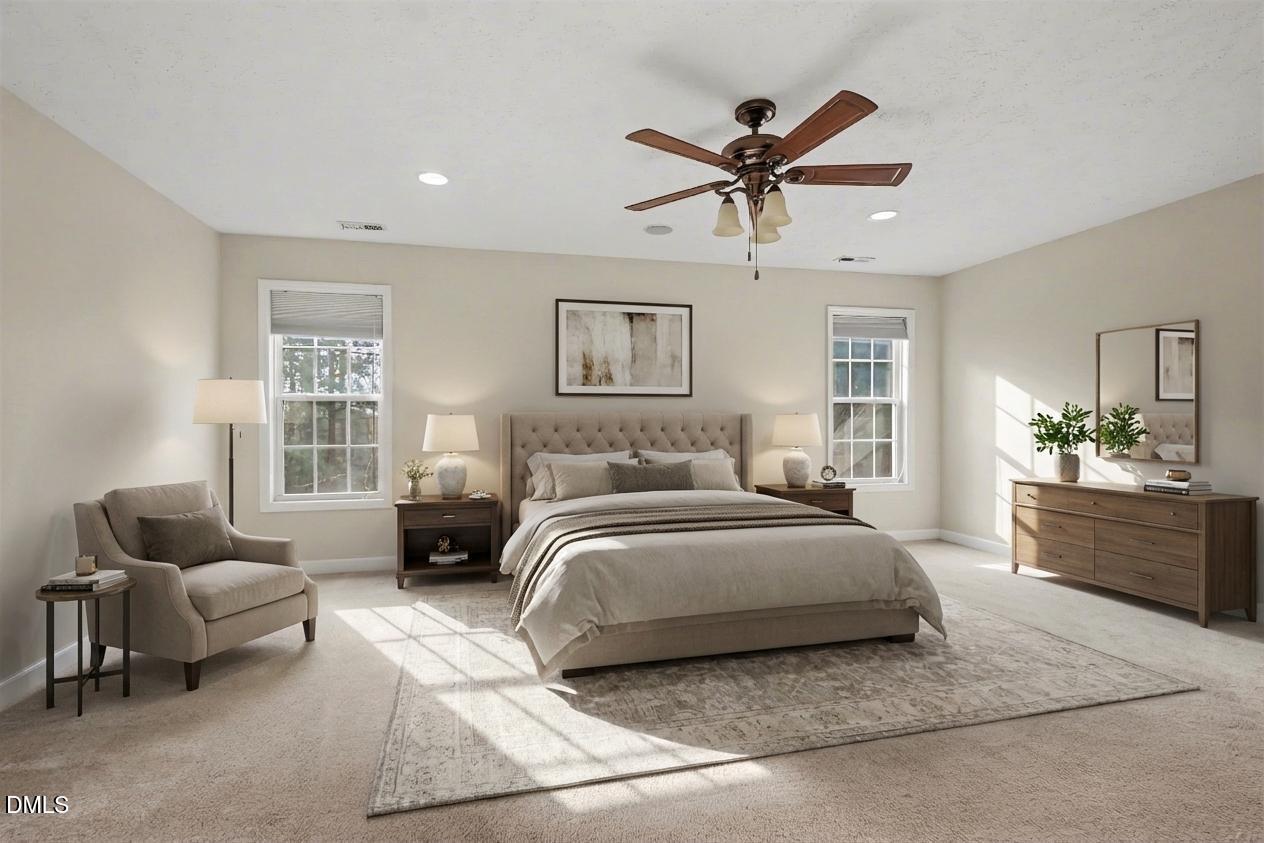 615 Lenoir Drive Spring Lake, NC 28390 - Photo 28 of 39 a spacious bedroom with a bed and couch