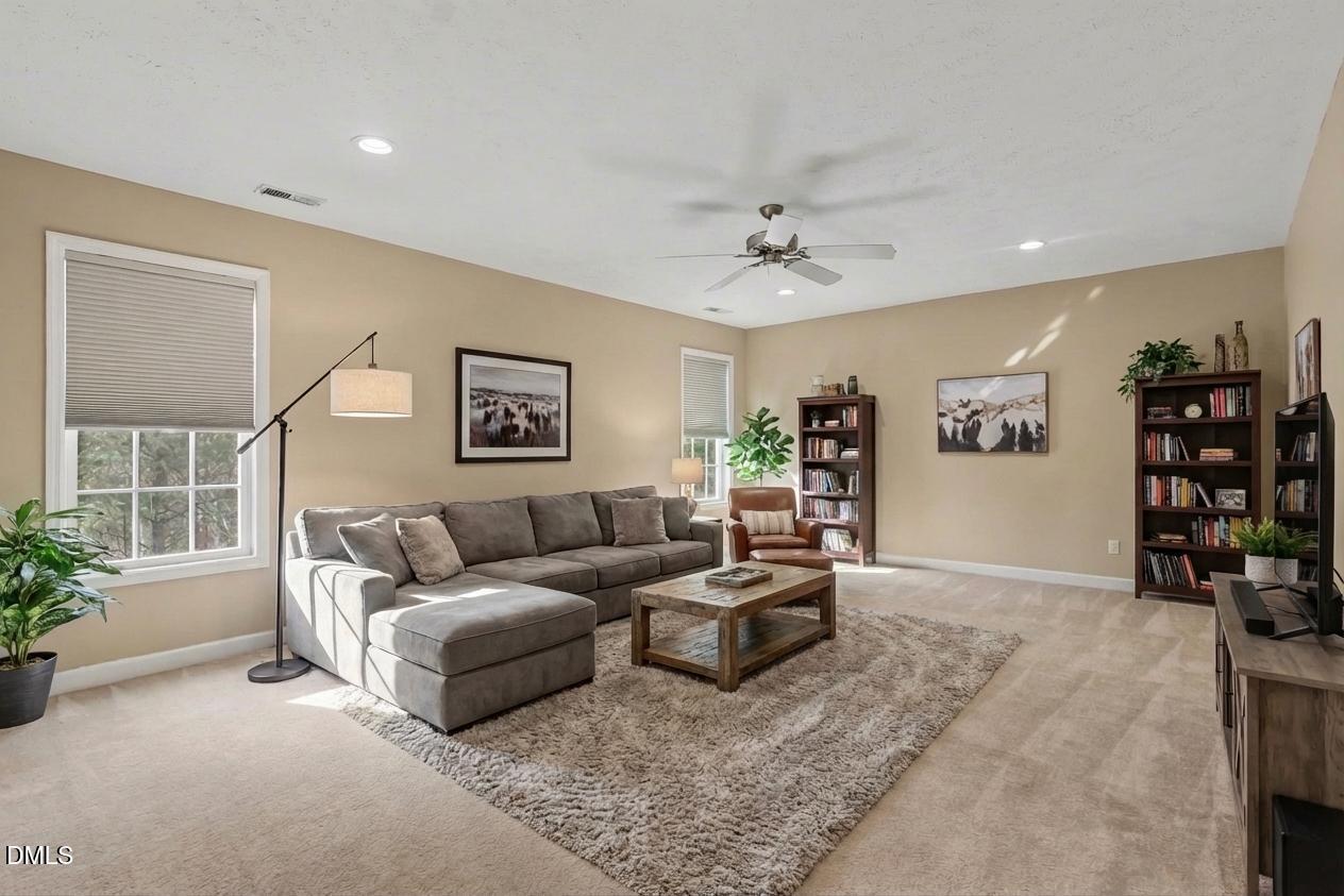 615 Lenoir Drive Spring Lake, NC 28390 - Photo 35 of 39 a living room with furniture and wooden floor