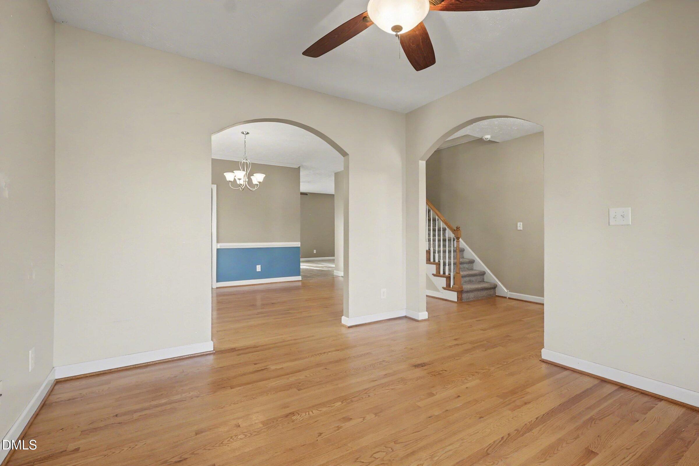 615 Lenoir Drive Spring Lake, NC 28390 - Photo 6 of 39 an empty room with wooden floor and windows