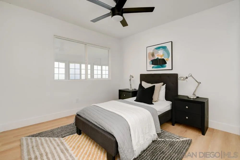 9428 Leticia Drive Santee, CA 92071 - Photo 14 of 17 a bedroom with a bed and window