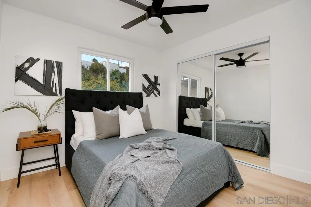 9428 Leticia Drive Santee, CA 92071 - Photo 15 of 17 a bedroom with a bed and window