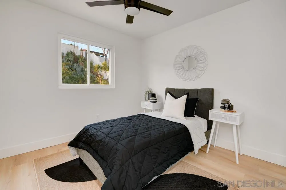 9428 Leticia Drive Santee, CA 92071 - Photo 16 of 17 a bedroom with a bed and a painting on the wall