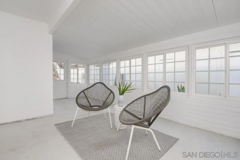 9428 Leticia Drive Santee, CA 92071 - Photo 5 of 17 a living room with furniture and a floor to ceiling window