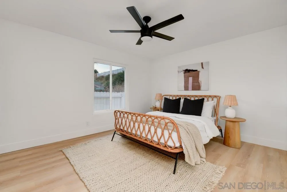 9428 Leticia Drive Santee, CA 92071 - Photo 9 of 17 a bedroom with a bed and a window