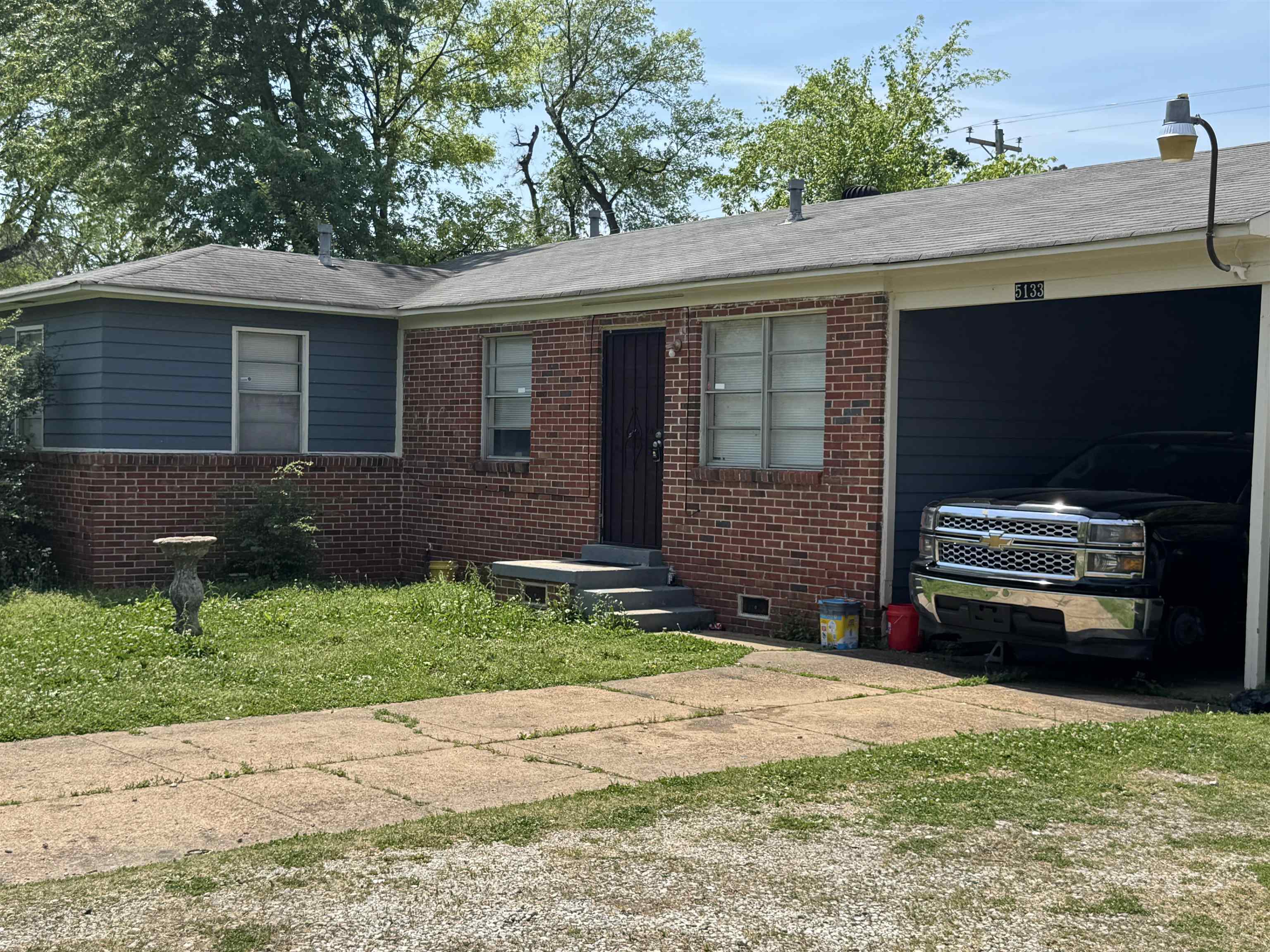 5133 Stacey Road Memphis, TN 38109 - Photo 10 of 10 Single story home with brick siding and driveway