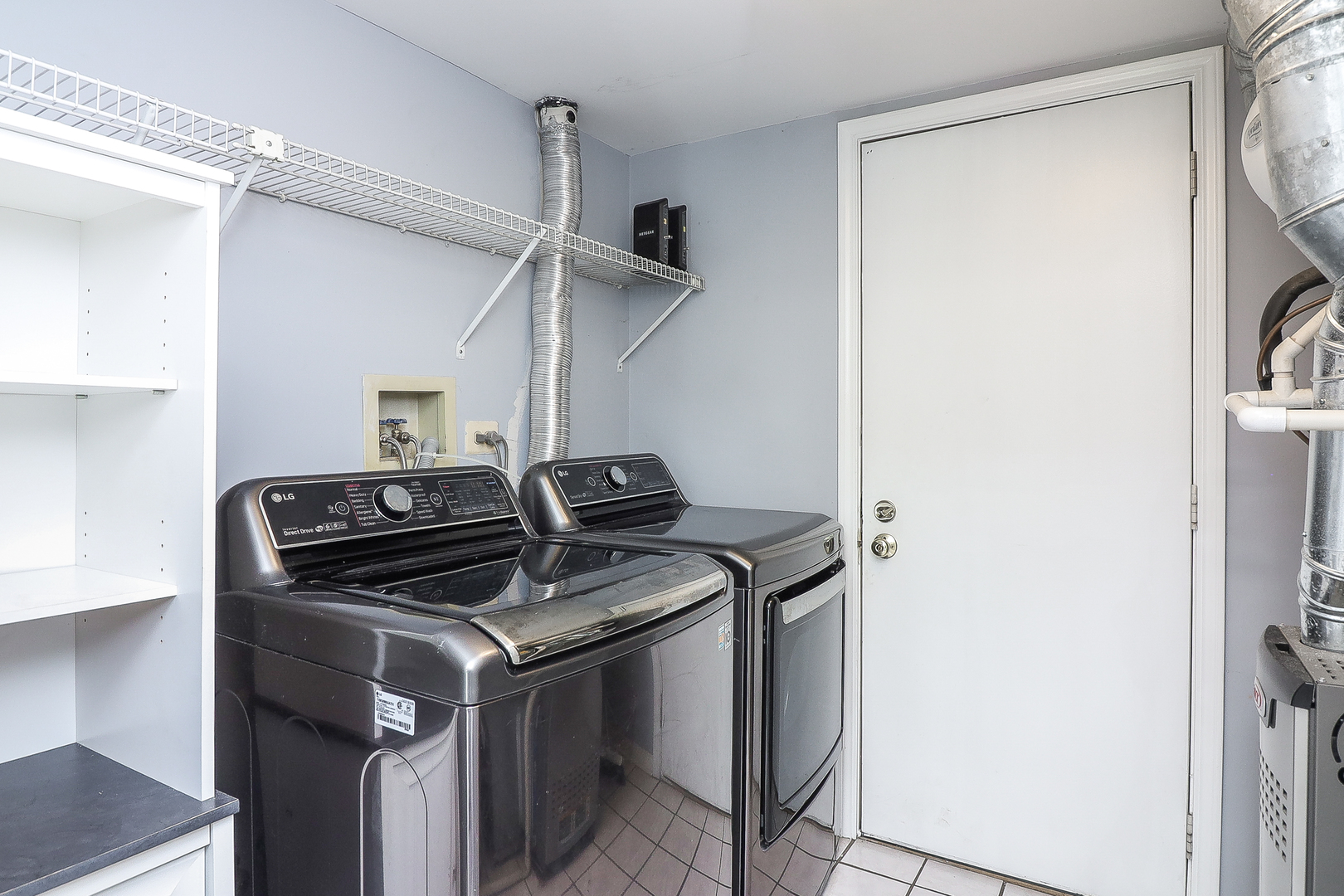 1288 Lakeshore Drive Carol Stream, IL 60188 - Photo 11 of 25 a kitchen that has a stove and a refrigerator