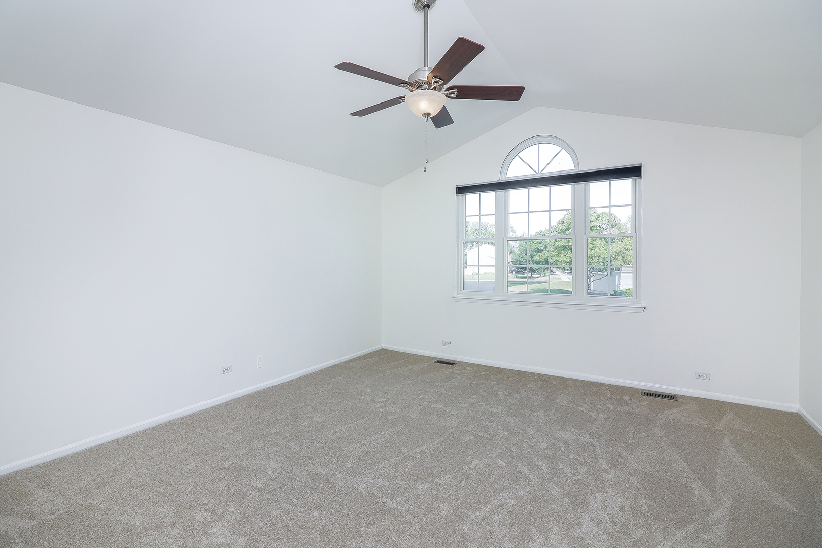 1288 Lakeshore Drive Carol Stream, IL 60188 - Photo 15 of 25 an empty room with a window and a ceiling fan