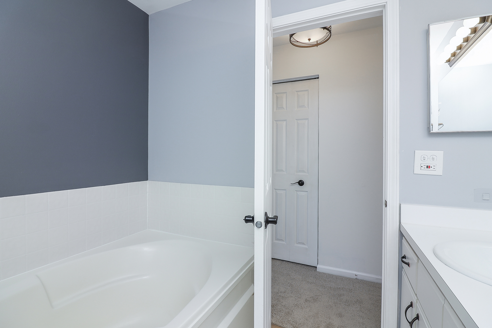 1288 Lakeshore Drive Carol Stream, IL 60188 - Photo 17 of 25 a bathroom with a bathtub and a shower