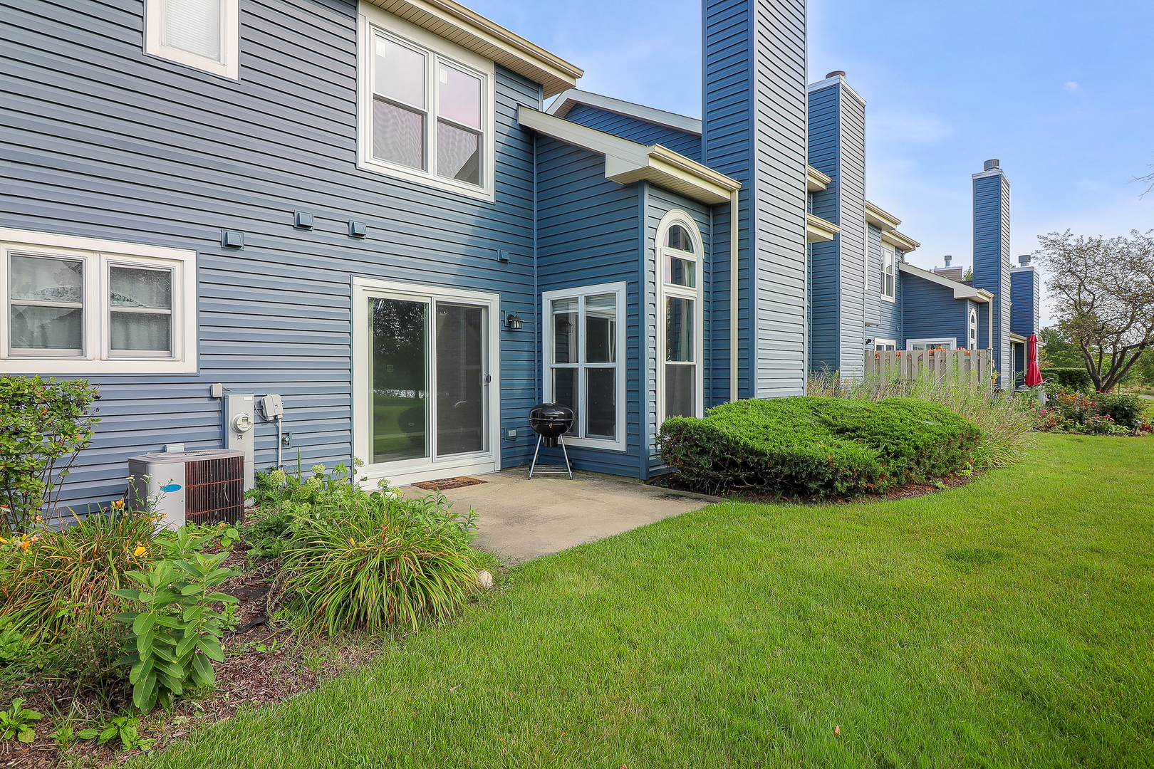 1288 Lakeshore Drive Carol Stream, IL 60188 - Photo 20 of 25 a view of a house with a yard and plants