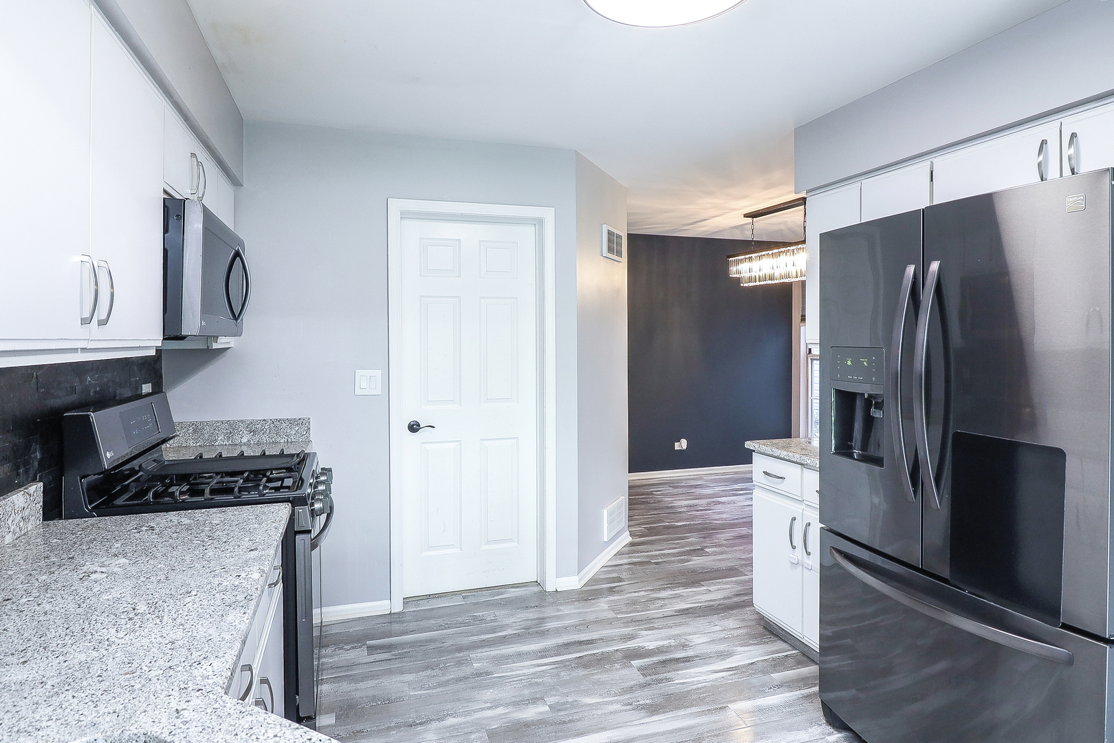 1288 Lakeshore Drive Carol Stream, IL 60188 - Photo 9 of 25 a kitchen with stainless steel appliances granite countertop a refrigerator and a stove