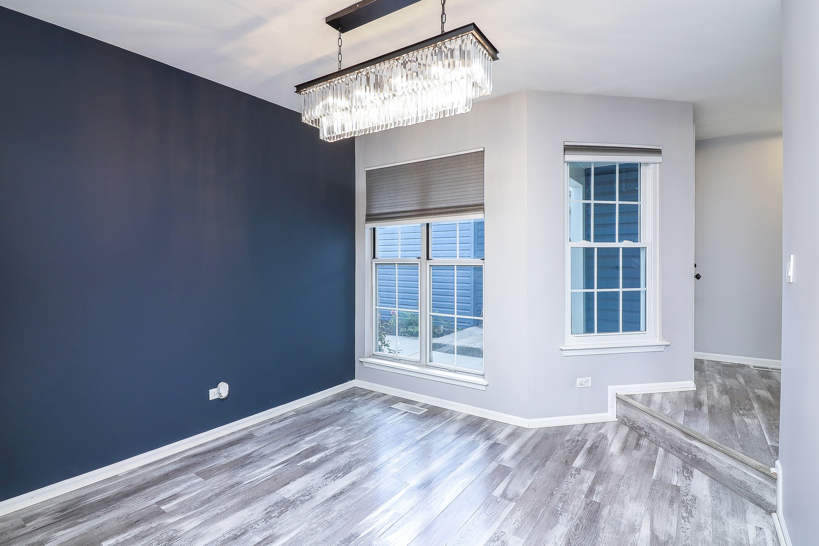 1288 Lakeshore Drive Carol Stream, IL 60188 - Photo 10 of 25 a view of an empty room with wooden floor and a window