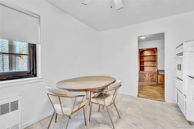 a view of a room with furniture and wooden floor