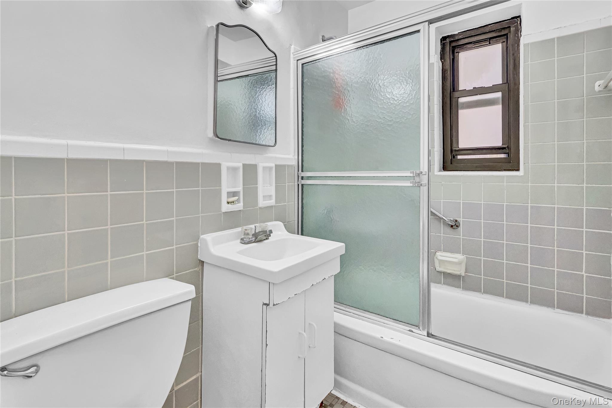 31-70 138th Street, Unit 3H Queens, NY 11354 - Photo 15 of 18 a bathroom with a sink a toilet and shower