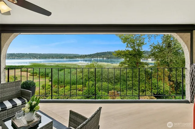 a kitchen with stainless steel appliances a stove microwave and refrigerator