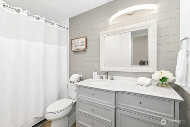 a view of a house with swimming pool and chairs