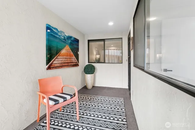 a view of room with furniture and windows