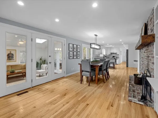 a living room with furniture and a lamp