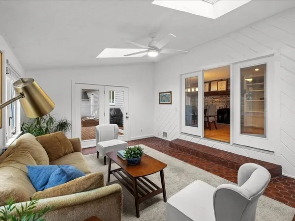 a spacious bedroom with a large bed and a window