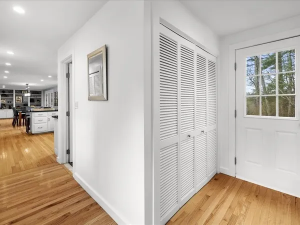 a kitchen with stainless steel appliances granite countertop a stove a sink dishwasher and a microwave oven with wooden floor