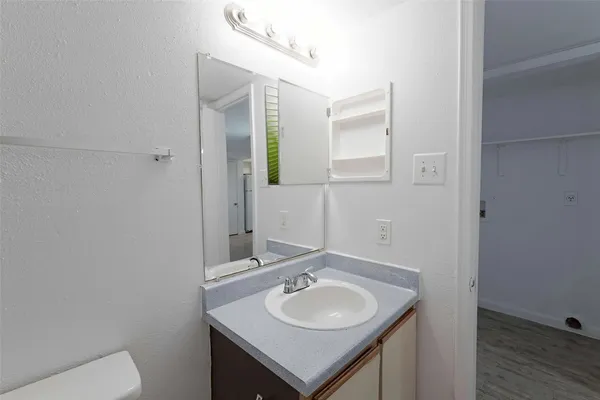 a bathroom with a sink and a toilet