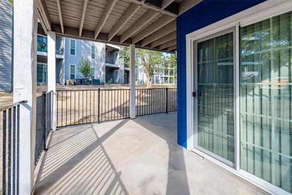a view of a porch with wooden floor