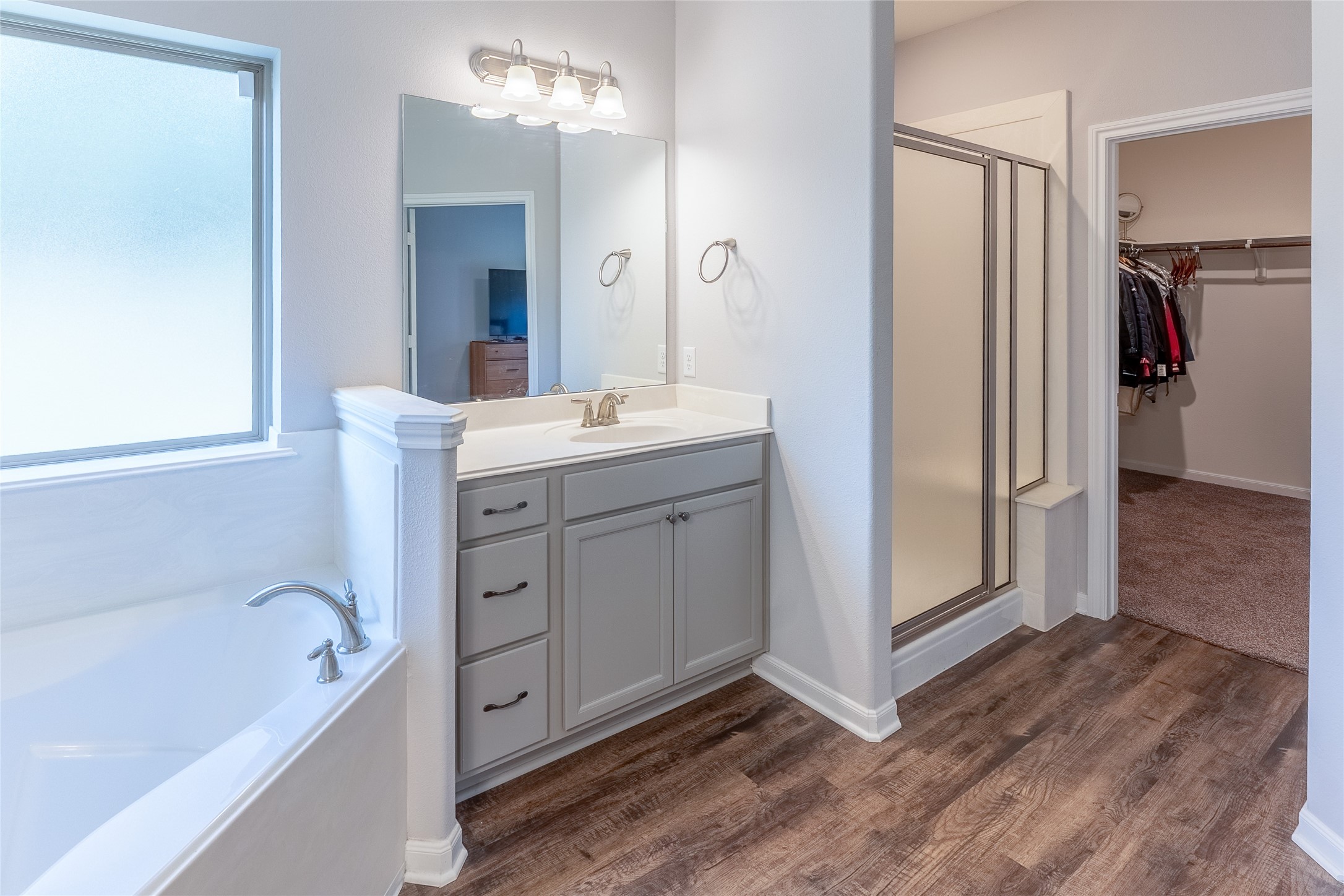 120 Sanctuary Road Huntsville, TX 77340 - Photo 26 of 38 a spacious bathroom with a tub sink and mirror