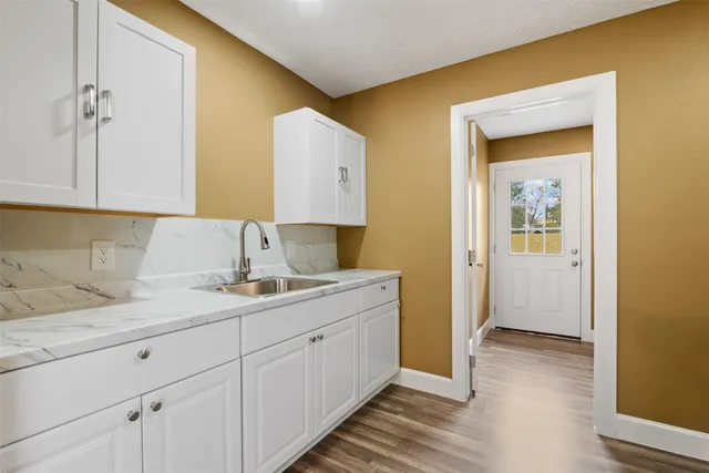 a kitchen with a sink and cabinets
