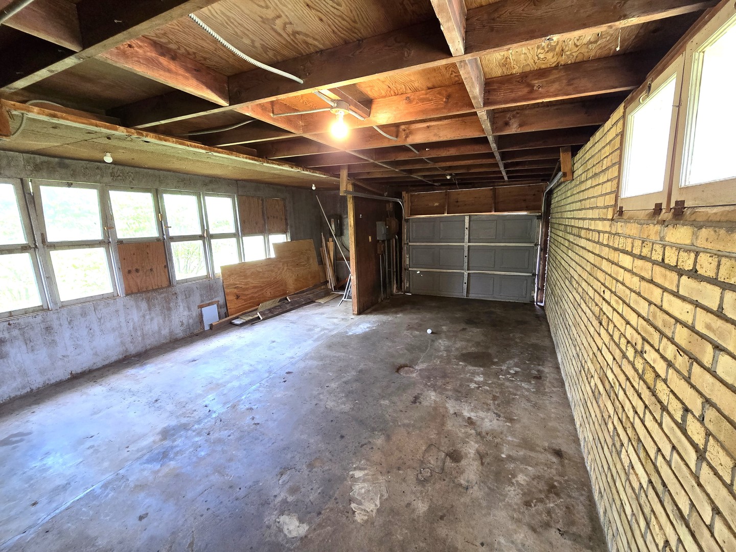 1316 South Fleming Road, Unit A Woodstock, IL 60098 - Photo 18 of 18 a view of an empty room with wooden floor and windows