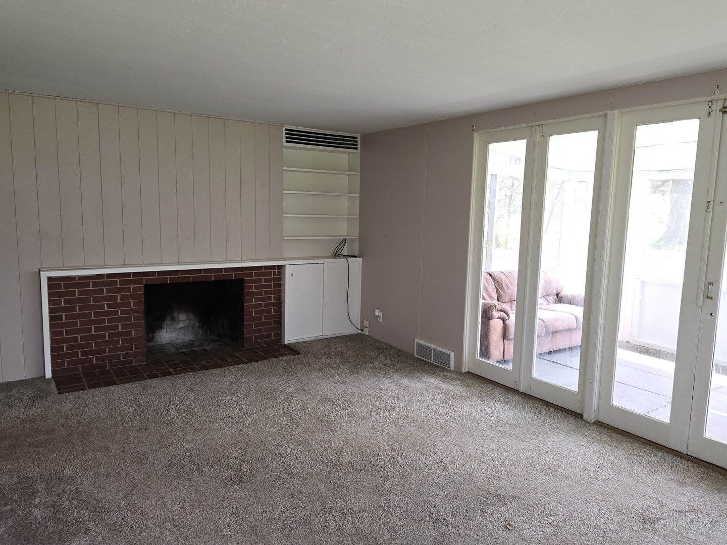 1316 South Fleming Road, Unit A Woodstock, IL 60098 - Photo 10 of 18 an empty room with windows