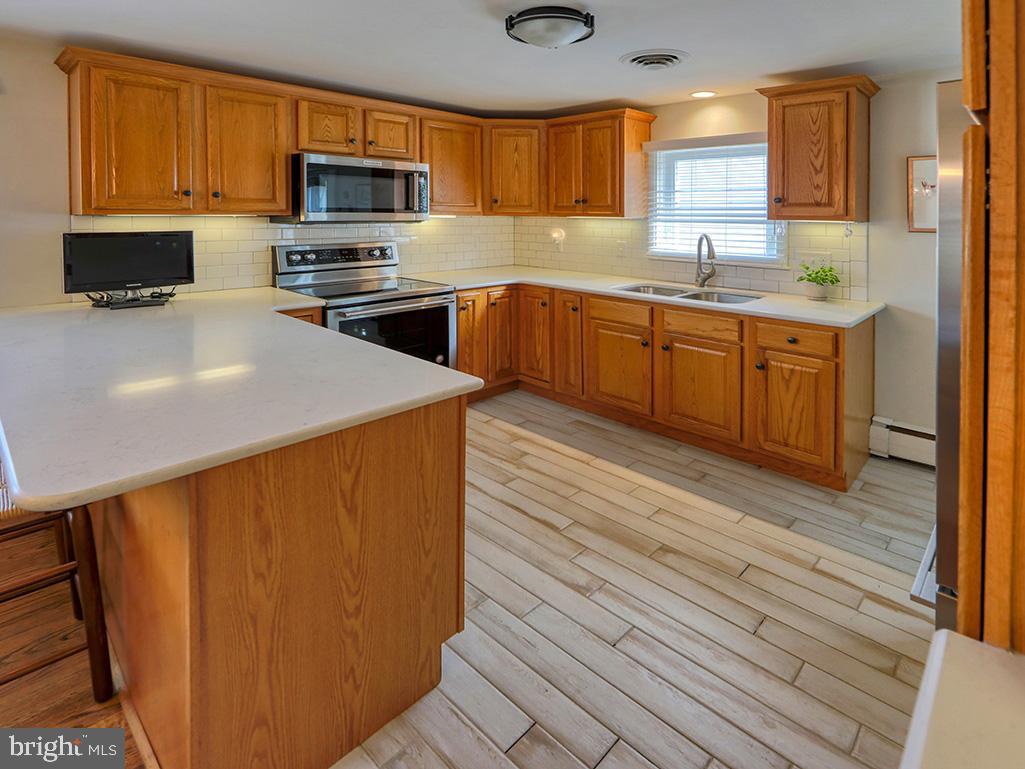 2605 York Road Lewes, DE 19958 - Photo 15 of 50 Kitchen w/tile floors & stainless appliances