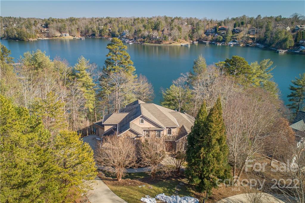 aerial view of a house with a lake view