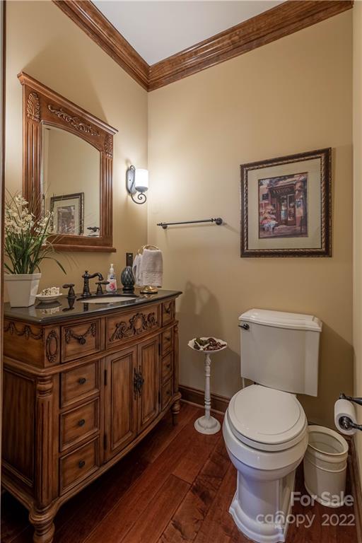 1849 Southpointe Drive Morganton, NC 28655 - Photo 19 of 48 a bathroom with a toilet a sink and mirror
