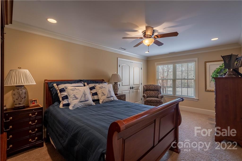 1849 Southpointe Drive Morganton, NC 28655 - Photo 24 of 48 a bed room with a bed and a chandelier