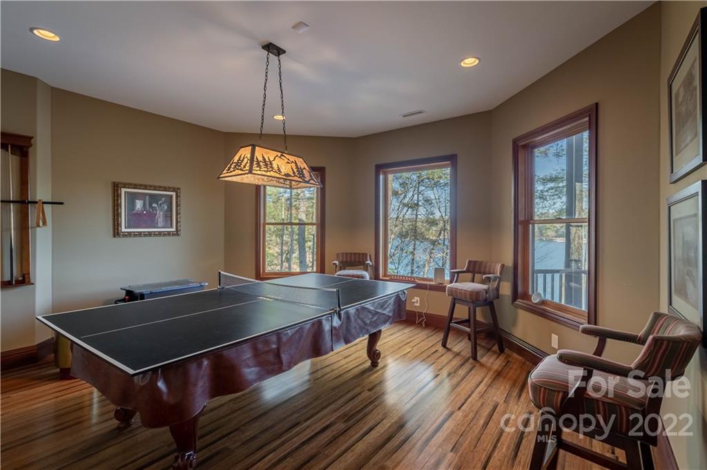 1849 Southpointe Drive Morganton, NC 28655 - Photo 32 of 48 a room with wooden floor pool table and windows