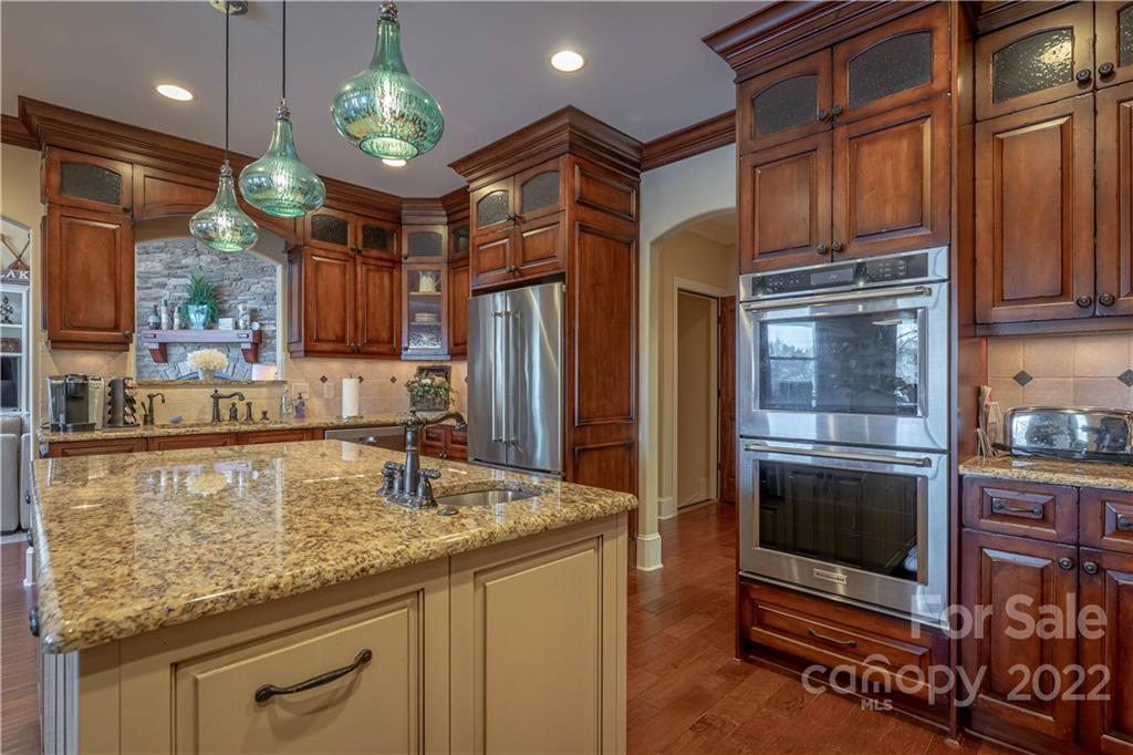 1849 Southpointe Drive Morganton, NC 28655 - Photo 6 of 48 a kitchen with stainless steel appliances granite countertop a refrigerator and a stove top oven
